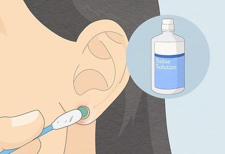 clean your ear piercing saline illustration by wikihow